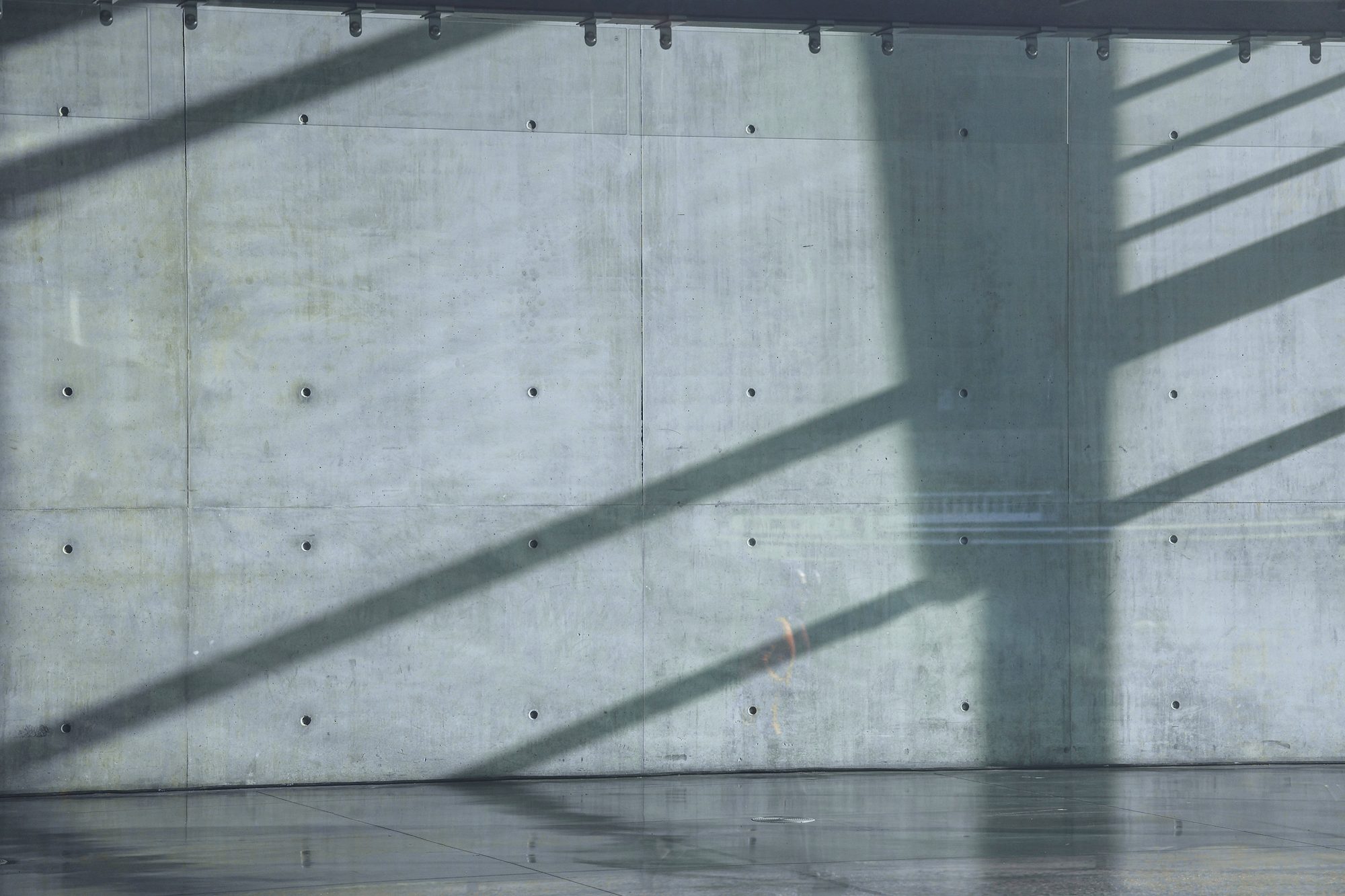 A concrete wall in raking light