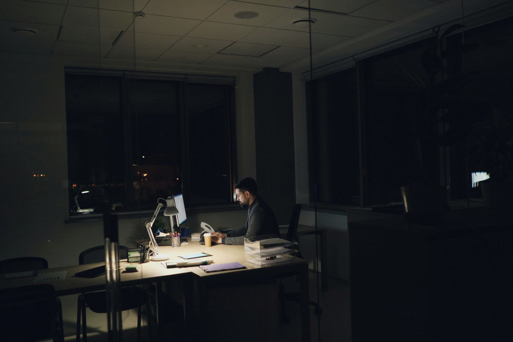 A person working late in a dim office